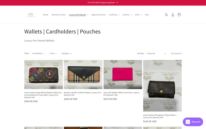 Website page titled Wallets | Cardholders | Pouches – L' Atelier Luxury Boutique