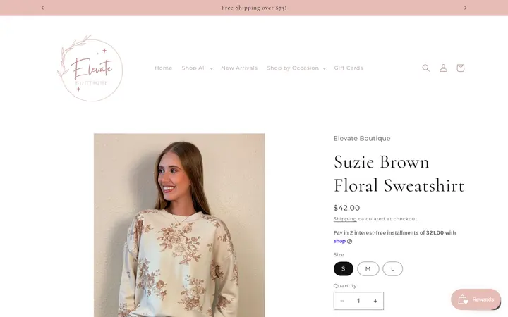 Website page titled Suzie Brown Floral Sweatshirt – Elevate Boutique