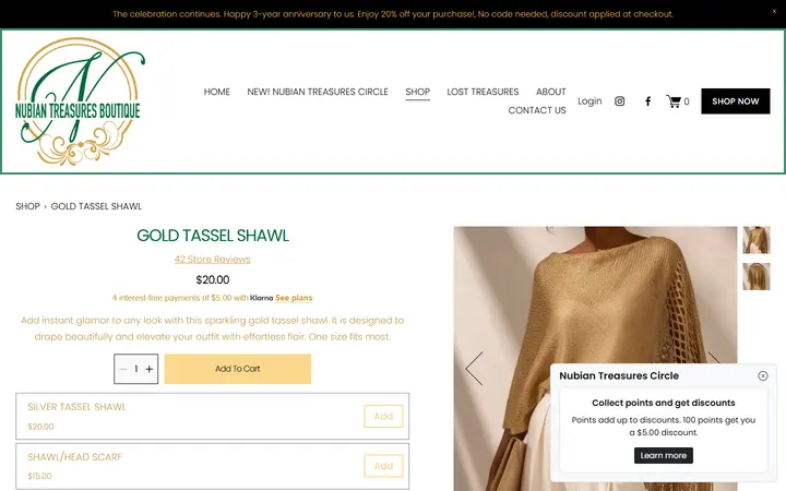 Website page titled GOLD TASSEL SHAWL — Nubian Treasures Boutique